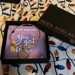 Brand new Gold and purple you got this Alex and ani bracelet